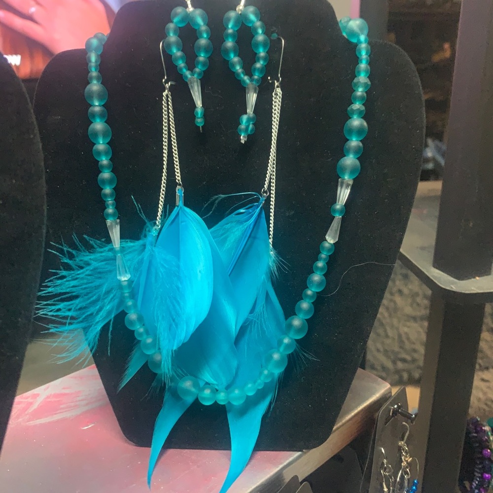 Two pairs of earrings and necklace